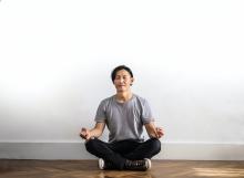 Beliefs - Person meditating on the floor